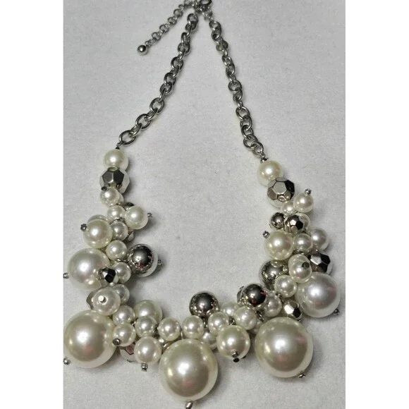 Chunky pearl necklace featuring a mix of faux pearls and silver-toned beads. - Picture 1 of 2